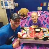 Skater John Coughlin with patient at Children's Mercy Hospital