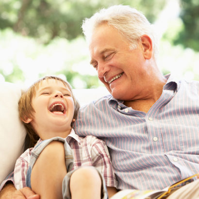 Grandfather and grandson laughing