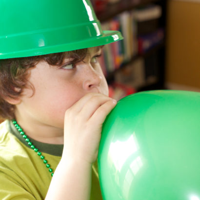Boy with green balloon