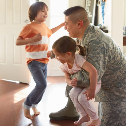 Military dad with children