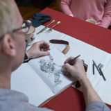 Hallmark Cards’ master artist and illustrator, Geoff Greenleaf on set drawing Santa Claus