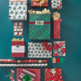 Assortment of holiday gift bags and wrapping paper