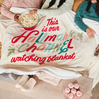 Fuzzy ivory Hallmark Channel Blanket with slogan “This is our Hallmark Channel watching blanket” printed on it