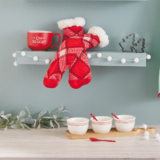 Hallmark Host Gift suggestions like cozy red sweater socks, a holiday mug, and holiday bowls